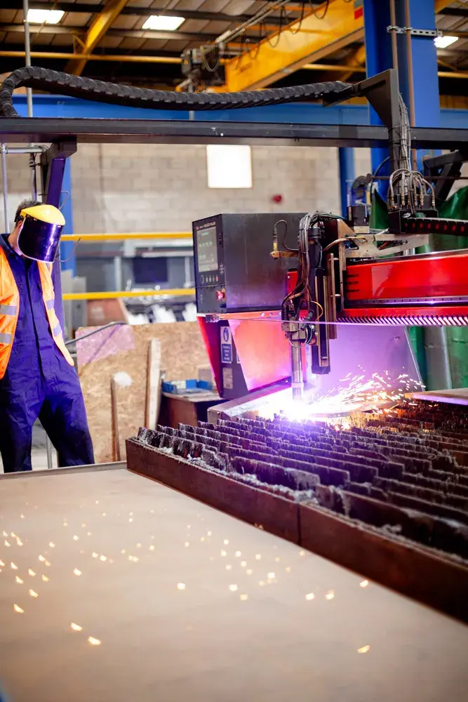 Plasma Cutting Machine in action with PP Group Operator and Visor